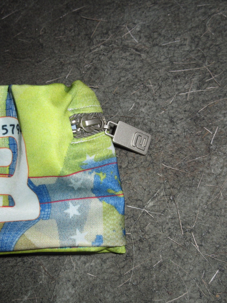 COUNTERFEIT EURO BICEP ZIPPER POCKET